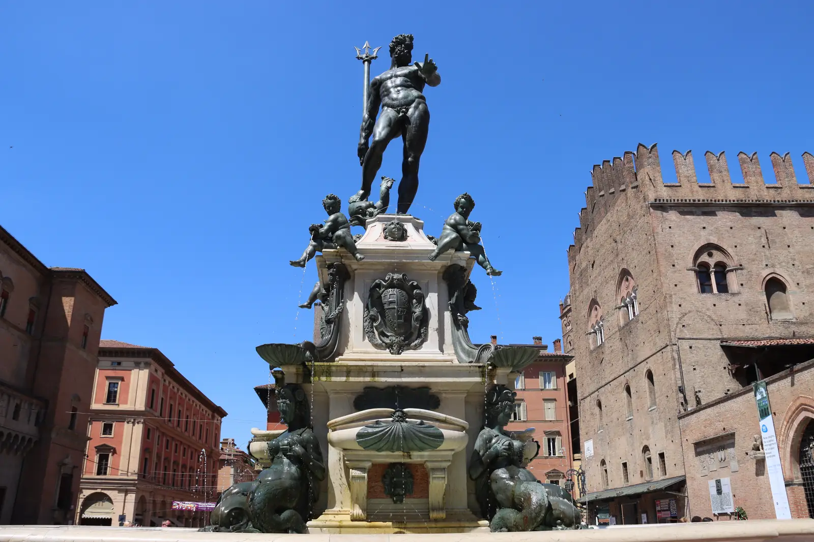 The bronze Neptune statue on the Fontana del Nettuno in Bologna